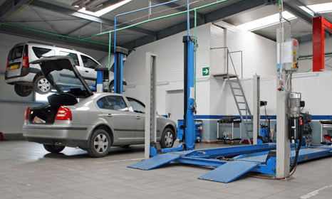 MOT repairs with 2 cars and one on a blue ramp